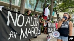 Demonstrators gather outside the Hawaii Convention Center in Honolulu, Nov. 18, 2023, to protest a visit by Philippines President Ferdinand Marcos Jr., and recall the actions taken by his late dictator father, Ferdinand Marcos Sr. 