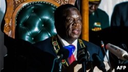 FILE: Zimbabwean President Emmerson Mnangagwa delivers his state of the nation address at a joint sitting of the parliament and the senate in Harare on December 20, 2017.