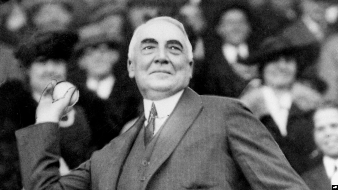 FILE - In this April 13, 1921, file photo, President Warren G. Harding throws out the first ball to open the Washington Senators' baseball season.