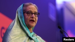 FILE - Bangladeshi Prime Minister Sheikh Hasina addresses the EU Global Gateway Forum 2023, in Brussels, Belgium, on Oct. 25, 2023. Russian media have repeatedly described the events that led to her resignation on August 5 as a U.S.-led color revolution. 