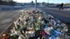 Flowers and candles are placed at a makeshift memorial near the scene of a mass shooting at an adult education center on the outskirts of Orebro, Sweden, Feb. 6, 2025.