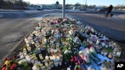 Flowers and candles are placed at a makeshift memorial near the scene of a mass shooting at an adult education center on the outskirts of Orebro, Sweden, Feb. 6, 2025.