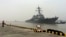Chinese Navy personnel stand guard as guided missile destroyer USS Stethem arrives at the Shanghai International Passenger Quay for a scheduled port visit in Shanghai, China, Nov. 16, 2015. 