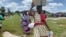 Food-insecure women leave a World Food Program relief center in Mudzi district, Zimbabwe, about 200 km east of Harare, Feb. 2020 (Columbus Mavhunga/VOA)