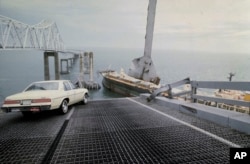 FILE - A car is halted at the edge of the Sunshine Skyway Bridge across Tampa Bay, Florida, after a freighter struck the bridge and tore away a large part of the span on May 9, 1980. The replacement bridge took five years to build and ran $20 million over budget.