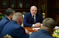 FILE - Belarusian President Alexander Lukashenko attends a meeting with top officials in Minsk, Jan. 26, 2021.