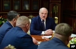FILE - Belarusian President Alexander Lukashenko attends a meeting with top officials in Minsk, Jan. 26, 2021.