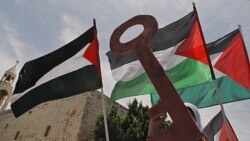 Palestinians take part in a demonstration to mark the 63rd anniversary of "Nakba," in Manger Square outside the Church of Nativity in the West Bank city of Bethlehem, May 12, 2011
