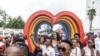 Members of the LGTBQ community take selfies in a Pride march in Johannesburg, South Africa, Oct. 26, 2024. 