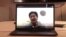 Thai medical student Badeephak Kaosala is seen on a computer screen as he speaks in an interview about being stranded in Wuhan, China, Jan. 27, 2020 in this still image taken from social media video. (Credit: Badeephak Kaosala)