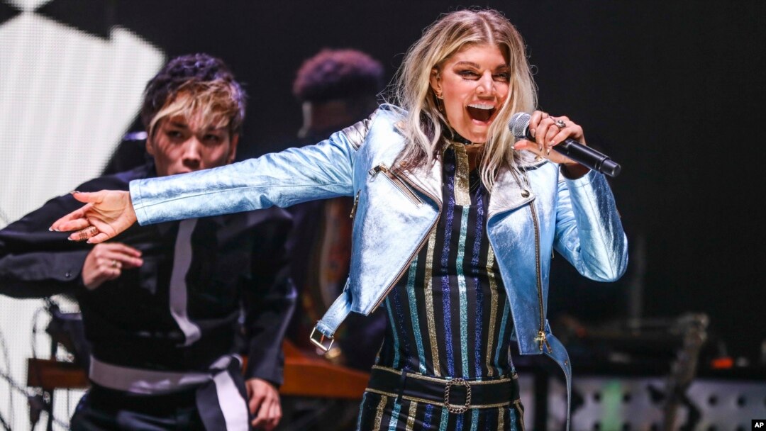 FILE - Fergie performs at the Tommy Hilfiger TommyxGigi Runway Show at Venice Beach in Los Angeles, Feb. 8, 2017.