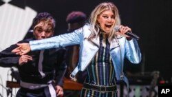 FILE - Fergie performs at the Tommy Hilfiger TommyxGigi Runway Show at Venice Beach in Los Angeles, Feb. 8, 2017.
