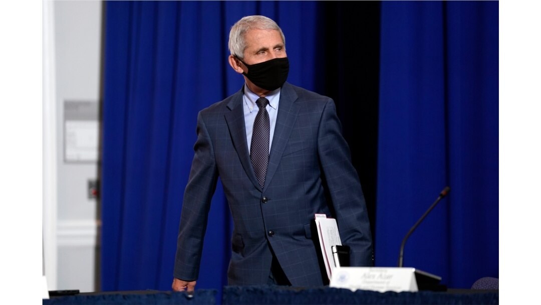 FILE - Dr. Anthony Fauci, director of the National Institute of Allergy and Infectious Diseases arrives to participate in a roundtable at the American Red Cross national headquarters in Washington.