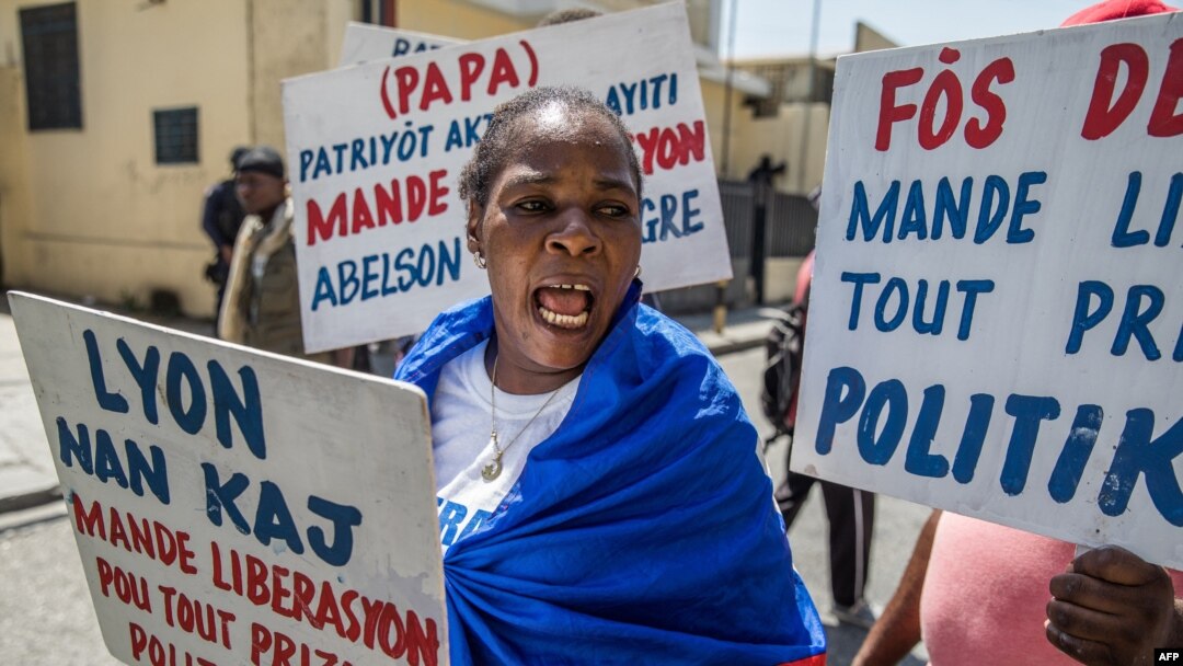 FILE - Haitians demonstrate in Port-au-Prince on Aug. 10, 2021, during a protest organized by human rights lawyers in front of the Ministry of Justice to demand the release of political prisoners and the scheduling of criminal trials. 