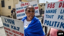 FILE - Haitians demonstrate in Port-au-Prince on Aug. 10, 2021, during a protest organized by human rights lawyers in front of the Ministry of Justice to demand the release of political prisoners and the scheduling of criminal trials. 