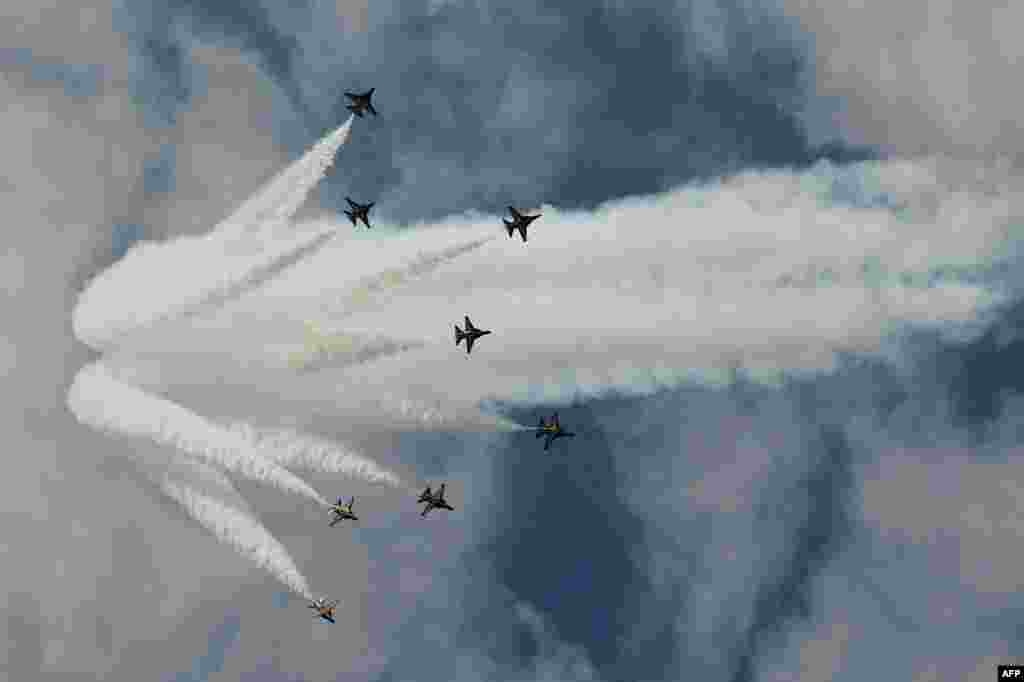 A South Korea Air Force aerobatic team, Black Eagles, flies in formation during a media preview ahead of Singapore&#39;s Airshow. Asia&#39;s top aerospace and defense show opens on February 11.