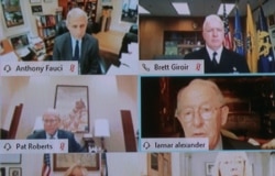 Chairman Lamar Alexander, R-Tenn., shown on a monitor, right, speaks during virtual Senate Committee for Health, Education, Labor, and Pensions hearing, May 12, 2020 on Capitol Hill in Washington.