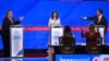 ARCHIVO - La exembajadora ante la ONU, Nikki Haley, observa mientras el gobernador de Florida, Ron DeSantis (Der) y el exgobernador de Nueva Jersey, Chris Christie (Izq), hablan en el cuarto debate de primarias republicanas, el 6 de diciembre de 2023 en Alabama. 