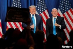 U.S. President Donald Trump and Vice President Mike Pence give thumbs up to the delegates after both addressing the first day of the 2020 Republican National Convention in Charlotte, North Carolina, Aug. 24, 2020.