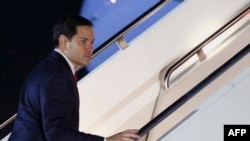 US Secretary of State Marco Rubio boards a plane to the Munich Security Conference in Germany from Joint Base Andrews, Maryland, on Feb. 13, 2025. 