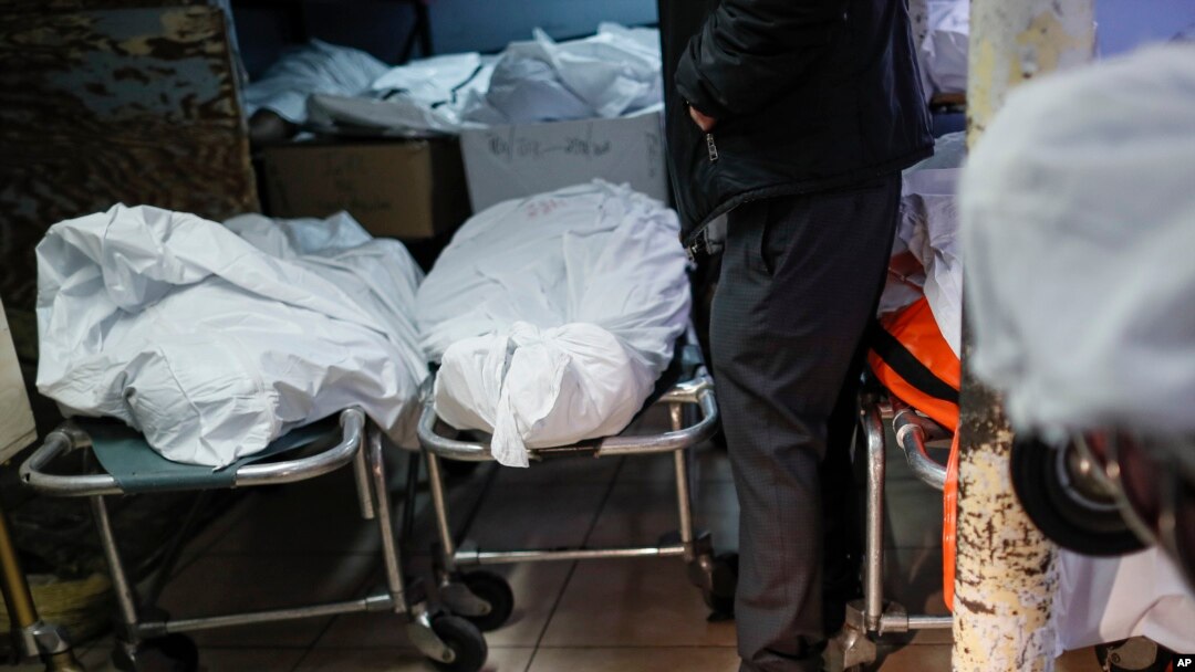 Pat Marmo, owner of Daniel J. Schaefer Funeral Home, walks through his body holding facility that is struggling to handle overflow of clients stemming from COVID-19 deaths, Thursday, April 2, 2020, in the Brooklyn borough of New York. "This is a…