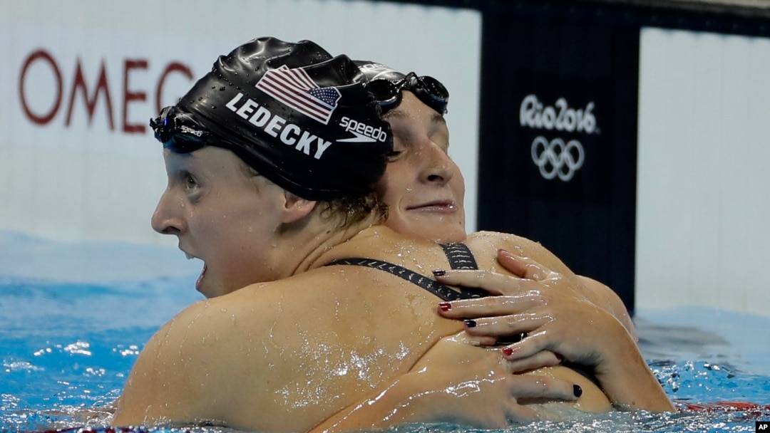 United States' Katie Ledecky, left, is congratulated by United States' Leah Smith after winning the gold medal in the women's 400-meter freestyle setting a new world record during the swimming competitions at the 2016 Summer Olympics, Sunday, Aug. 7, 2016
