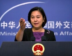 FILE - Chinese Foreign Ministry spokeswoman Hua Chunying speaks during a press briefing at the Ministry of Foreign Affairs building in Beijing, Sept. 15, 2017.