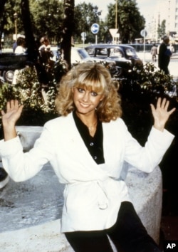 FILE - Olivia Newton-John in 1978, thrown into the full glare of showbiz success with her American movie debut in Grease, currently being shown in London. (AP Photo/John Glanvill)