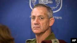 FILE - In this July 31, 2014 file photo, then-Chief of General Staff of the Israel Defense Forces Lt. Gen. Benny Gantz attends a Cabinet meeting at the Defense Ministry, in Tel Aviv, Israel.