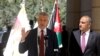 Amman Mayor Yousef Al-Shawarbeh listens to U.N. High Commissioner for Refugees Filippo Grandi as he speaks during the opening of a bazaar to mark World Refugee Day, in Amman, Jordan, June 20, 2019.