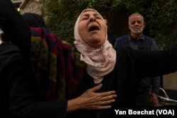 A woman cries in downtown Damascus, Syria, after not being able to identify her son among the corpses brought to a morgue from one of the biggest Assad’s regime’s prison, Dec. 13, 2024.