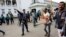 Police try to stop activists of ruling party Bangladesh Awami League from attacking lawyers loyal to Bangladesh Nationalist Party (BNP) and Bangladesh Jamaat-E-Islami during a protest inside the premises of Supreme Court in Dhaka, Dec. 29, 2013.