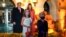 President Donald Trump and first lady Melania Trump poses for a photo with children dressed as them as they greet trick-or-treaters on the South Lawn during a Halloween celebration at the White House, Oct. 25, 2020. 