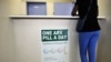 FILE - A woman queues at Phedisong clinic on April 8, 2013, during the launch of the new single dose anti-AIDS drug in Ga-Rankuwa, north of Johannesburg. South Africa is considered a success story for its treatment for and prevention of HIV. 