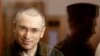 Jailed Russian former oil tycoon Mikhail Khodorkovsky attends a court session in Moscow July 22, 2010. Khodorkovsky and his business partner Platon Lebedev face a second round of trials on charges of theft and money laundering. REUTERS/Sergei Karpukhin (R