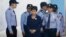 Former South Korean President Park Geun-hye, center, arrives for a court hearing in Seoul, South Korea, May 23, 2017. North Korea on Wednesday vowed to execute Park and her spy director, accusing them of planning to assassinate its supreme leadership.