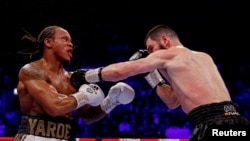 Bingwa wa Light Heavy Artur Beterbiev kulia akirusha konde dhidi ya Anthony Yarde huko Wembley Arena, London, Uingereza - Januari 28, 2023 ambapo alimshinda kwa KO. Reuters.
