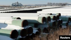 FILE - A depot used to store pipes for TransCanada Corp.'s planned Keystone XL oil pipeline is seen in Gascoyne, North Dakota, Nov. 14, 2014. 