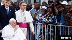 Pope Francis waves at people during his apostolic journey, in Kinshasa, Democratic Republic of the Congo Feb. 3, 2023.