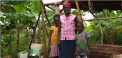 Kore Lavi participant Marie Anna Jolicoeur, a widowed farmer and two of her five children. (Photo: USAID)