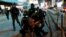 Riot police detain an anti-government protester during a protest at Mong Kok, in Hong Kong, China, May 10, 2020. 
