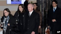 Deputy U.S. trade representative Jeffrey D. Gerrish, center, and members of his delegation leave the Westin hotel in Beijing, China, Jan. 7, 2019, for talks with their Chinese counterparts.