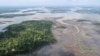 FILE - An overview of the Niger Delta where signs of oil spills can be seen in the water in Port Harcourt, Nigeria, Aug. 1, 2018. 