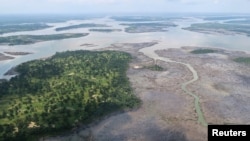 FILE - An overview of the Niger Delta, where signs of oil spills can be seen in the water in Port Harcourt, Nigeria, Aug. 1, 2018. 