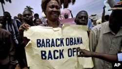 A woman holding a placard as she takes part in an anti-gay demonstration in Jinja, Kampala, (File)