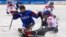 Czech Republic's Jiri Raul keeps the puck from South Korea's Choi Kwang Hyouk, left, during a preliminary Ice Hockey match of the 2018 Winter Paralympics held in Guangneung, South Korea, March 11, 2018.