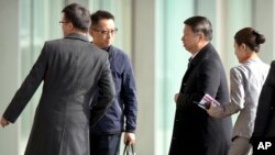 Song Tao, center, the head of China's Communist Party's International Liaison Department, arrives at Beijing Capital International Airport, Nov. 17, 2017. Song will travel to Pyongyang Friday, the first ministerial-level Chinese official to visit North Korea since October 2015.