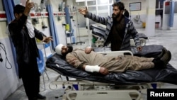 An Afghan injured man receives treatment at a hospital after a car bomb blast in Kabul, Afghanistan, Jan. 14, 2019.