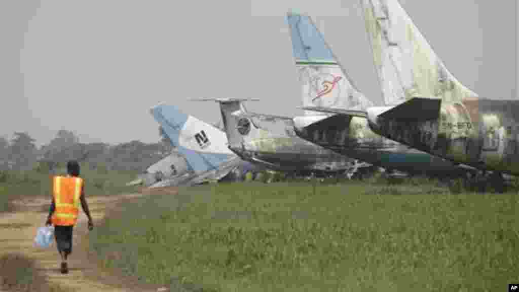 A man walks toward a row of abandoned airplanes at Murtala Muhammed International Airport in Lagos, Nigeria.