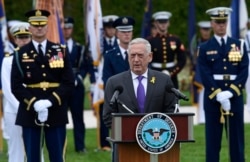 FILE - Defense Secretary Jim Mattis speaks during the 2018 POW/MIA National Recognition Day Ceremony at the Pentagon in Washington, Sept. 21, 2018.